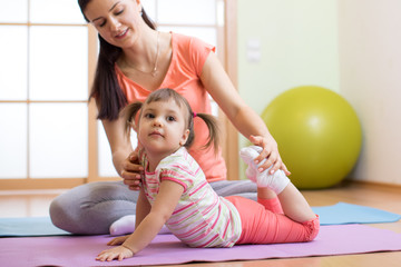 Fototapeta premium Kids yoga female teacher training child