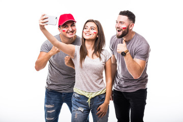 Selfie on phone of Poland football fan in game supporting of Poland national teams on white background. Football fans concept.