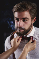 Handsome man with cuban cigar flirting