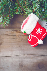 Obraz na płótnie Canvas Christmas decorations on old dark boards. Christmas background. Christmas Socks. New Year background. Xmax background. Christmas tree. Toned image.