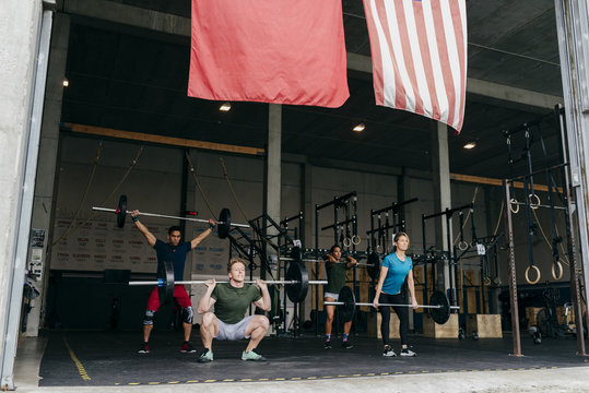Group of people lifting weights