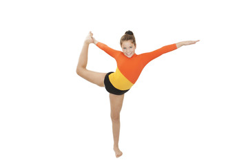 Obraz premium Little gymnast on a white background. Sporting exercise, stretch, flexibility, aerobic