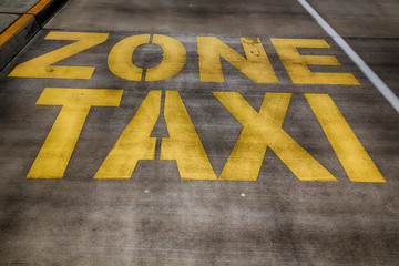  the line painted  in the asphalt for    taxy zone
