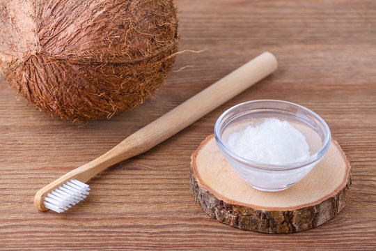 coconut oil toothpaste, natural alternative for healthy teeth, wooden toothbrush