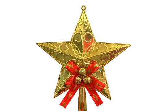 Gold glitter star decoration on top of a Christmas tree with isolated against white