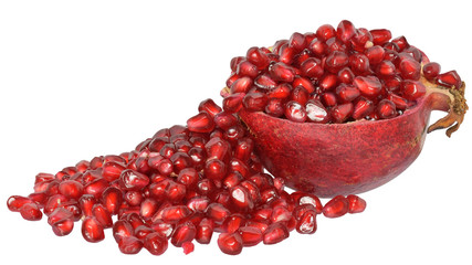 Cut pomegranate with scattered grain isolated