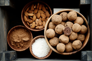 Raw candies from dates, cocoa, coconut and nuts. Vegetarian food. The concept of a healthy diet
