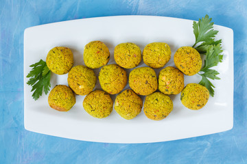 Fresh baked falafel with parsley. Vegan dietary healthy food concept.