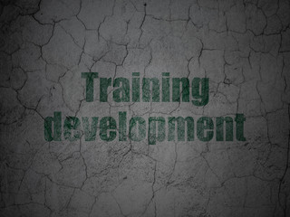 Studying concept: Green Training Development on grunge textured concrete wall background