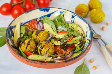 Falafel salad with fresh vegetables, sprouts and hemp dressing