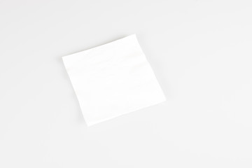 A one small disposable white napkin