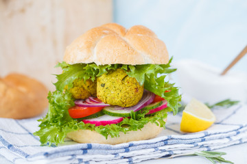 Vegan falafel burger with vegetables.