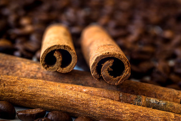 Cinnamon stick on the background of coffee
