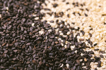 Black and white sesame seeds. Copy space. Top view.