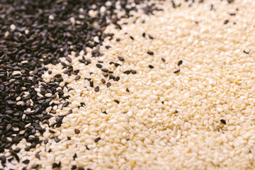 Black and white sesame seeds. Copy space. Top view.
