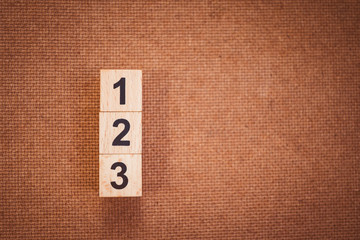 Block number one two three isolated on wooden background - Vintage filter