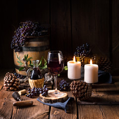 Naklejka na ściany i meble Red wine from a barrel with grapes and a glass of wine