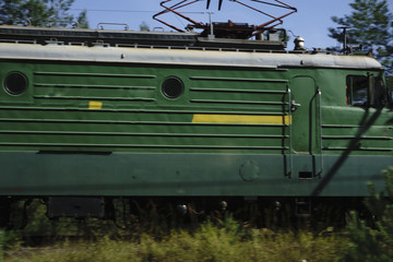 Cargo locomotive railroad engine crossing desert wilderness,rails