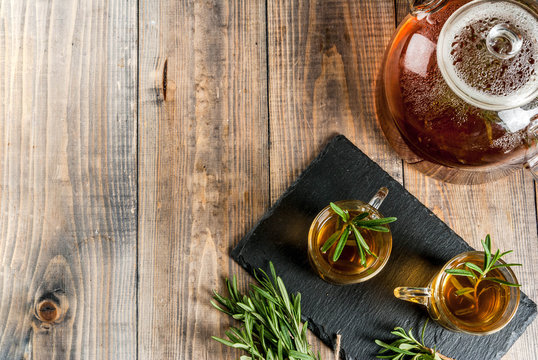 Rosemary tea on  wooden background. Copy space
