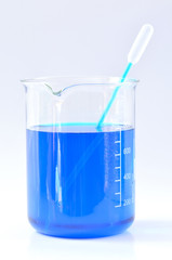 Chemical beaker with blue chemicals dissolved in water