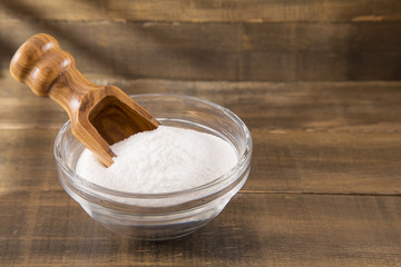 baking soda (Sodium bicarbonate) on a wooden spoon