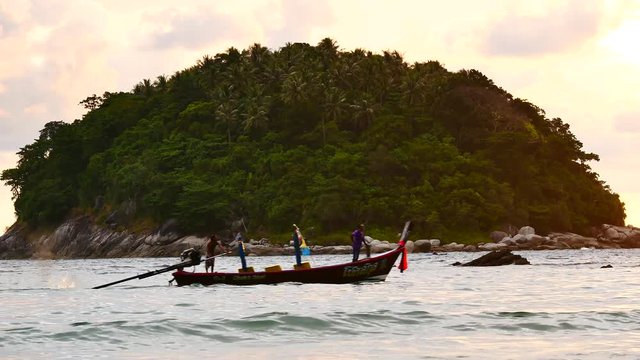 The fishing boat was sailing the coast after sailing boat to the sea to go fishing in the Andaman Sea.In the Andaman Sea with the natural integrity of marine animals.