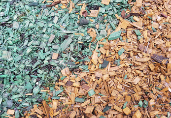 Decoration of the ground in the park with bright wooden chips
