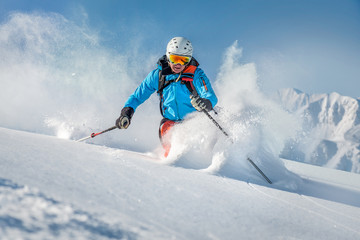 Fototapeta na wymiar Male freeride skier in the mountains off-piste