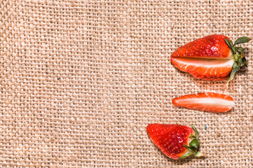 Red strawberries, fresh fruit on rustic background
