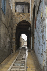 Fototapeta na wymiar Steps at narrow street, Acre, Israel