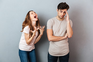 Portrait of a upset young couple having an argument