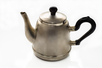 Vintage, old teapot from the samovar on a white background