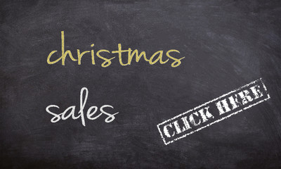 Obraz premium christmass sales chalk handwritten text on a black board with stars illustration and click here rubber stamp