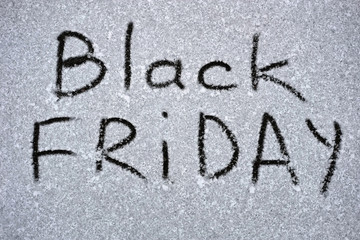 An inscription on the snow is about approaching black Friday. Photo of the inscription on the snow Black Friday