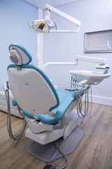 Dentist chair with medical equipment in clinic