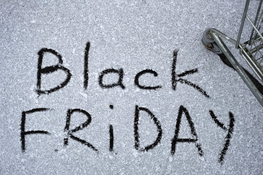Photo of the inscription on the snow Black Friday. An inscription on the snow is about approaching black Friday.