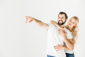 couple pointing away with finger