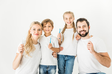 family with toothbrushes