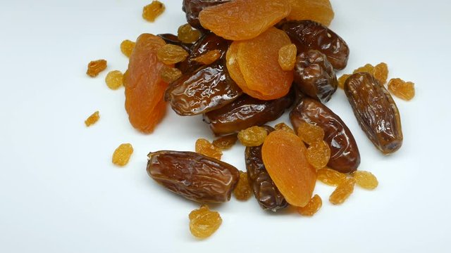 4k, Dried fruits rotate on a white background. dried apricots, raisins, Date Fruits