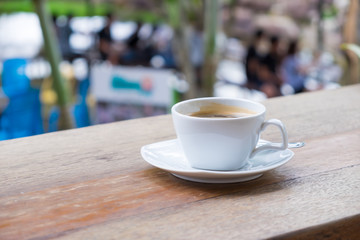 Black coffee on the wood table.