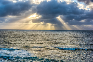 Sun rays passing through the clouds in Alghero