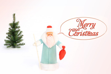 Santa Claus (Father Frost) and Christmas tree in the snow