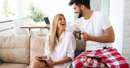 Young attractive couple spending time together at home