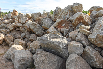 Fototapeta na wymiar Big stone pile outdoors. For the construction of structures that require high stability. 