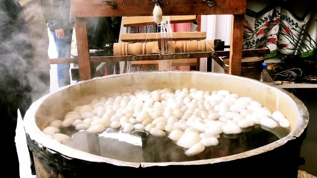 Silk cocoon boiling process. Silk Silk making and handmade craft (serial 3)