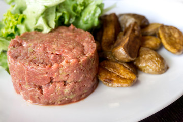 tasty Steak tartare (Raw beef) - classic steak tartare on white plate