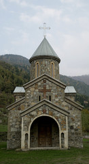 Fototapeta na wymiar A Church in Between the Green Forest in Georgia, Oladauri