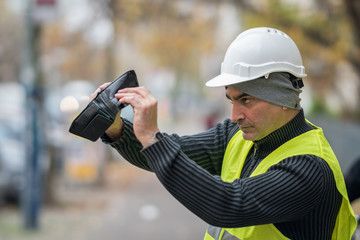 Bad times: engineer looking into his empty wallet