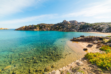 Fototapeta na wymiar Turquoise water in Spalmatore beach in La Maddalena