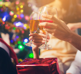 Group Of Friends Enjoying Christmas Drinks In Bar Celebrating x mas at home